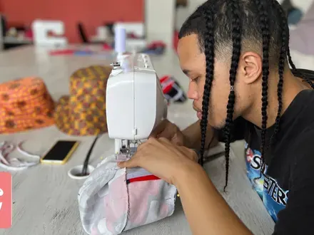 Sew & Grow student &mdash; close work at the needle