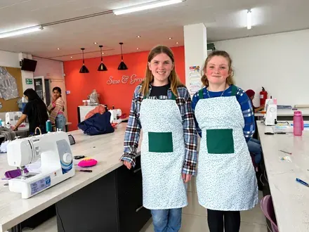Sew & Grow student &mdash; aprons on the line