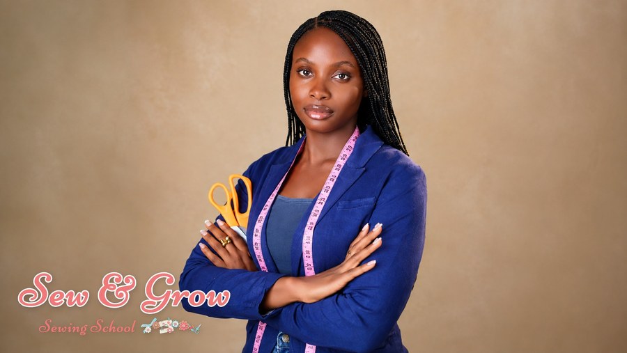 A confident dressmaker with scissors and a tape measure round the neck