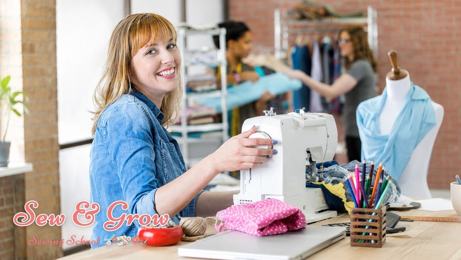 A happy sewer at her machine in a bright studio