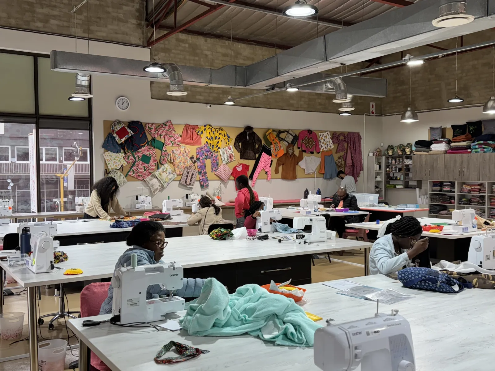 Students sewing at machines in the Sew & Grow studio in Melville, Johannesburg